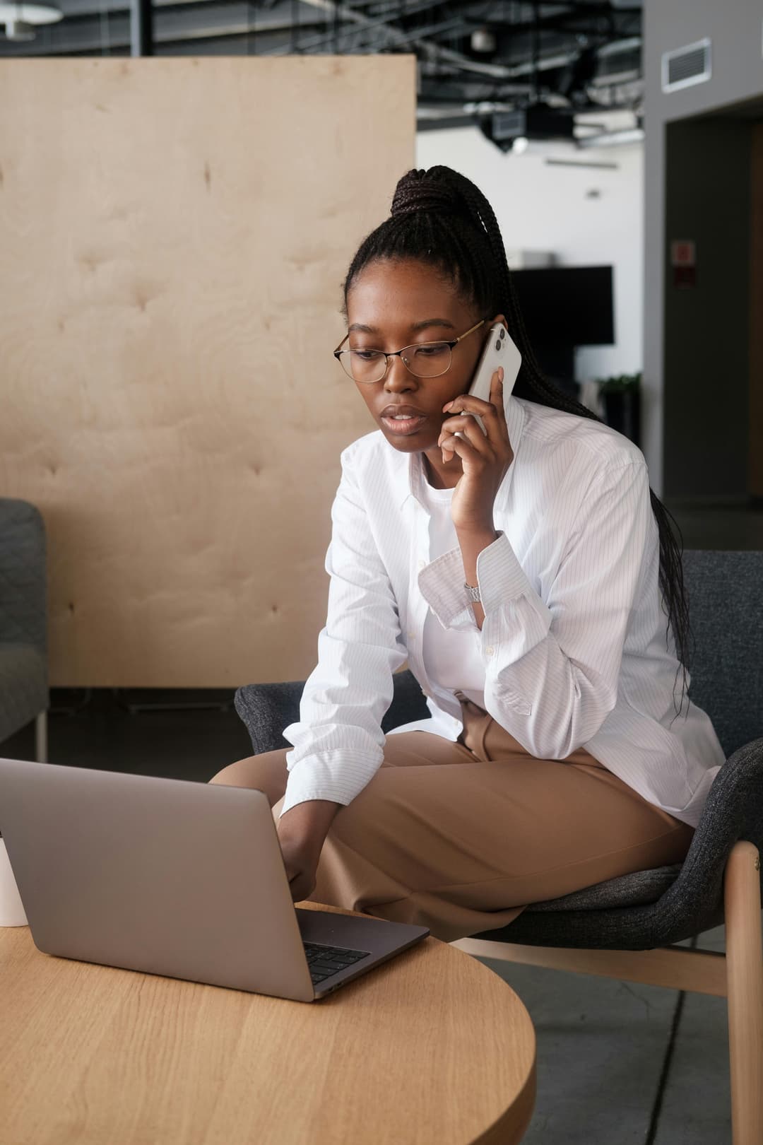 Woman working remotely from a kitchen table